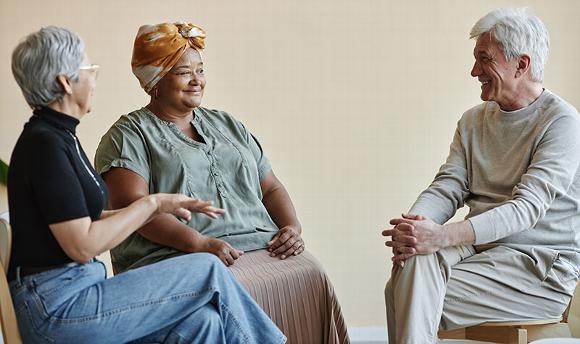 Care worker talking with older couple